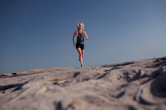 Female runner Morning Cliffside
