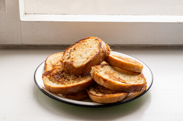 fried slices of wheat bread on a plate