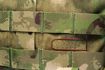 Close up still life of a green army tactical backpack