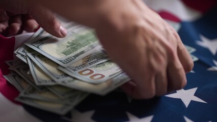 dollar money and American flag. bankrupt man counting money cash. business crisis finance dollar concept. close-up of a hand counting usd paper dollars. exchange finance economy dollar pay tax