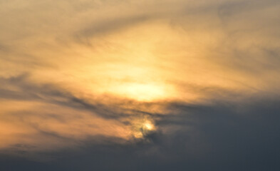 Naklejka na ściany i meble Sunset sky behind clouds, Nature background