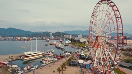 beautiful scenic drone shot of Ferris wheel and port in Batumi city, Georgia, Europe. High quality photo