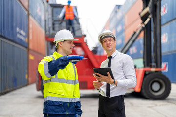 Container yard manager briefing work plan with the supervisor at container yard warehouse.