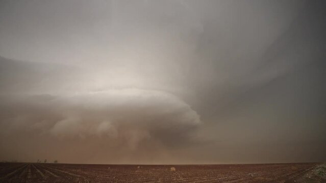 Lightning strikes during dangerous storm as supercell moves over the landscape in Texas.
