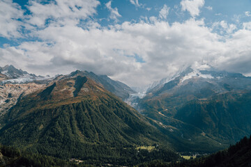 Wide View of Swiss Alp Mountains with Blue Sky and Clouds - 508585858