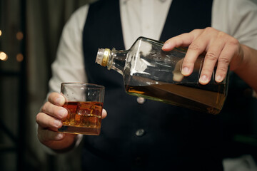 Barman pouring beer glass beautiful night