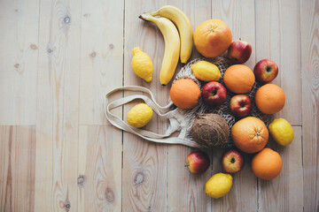 Obraz na płótnie Canvas Fresh fruits on wooden background. Copy space.