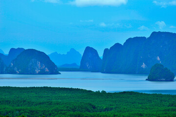 Samet Nangshe Viewpoint, limestone karst formations and small islands at Phang Nga Bay with the beautiful clouds background, Phang-Nga province Thailand.