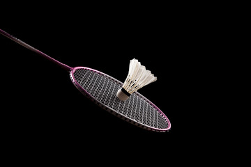 badminton racket and shuttlecock isolated on black background
