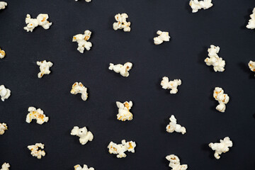 Popcorn on an black background, close-up view from above