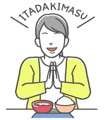 食事の前にいただきますの挨拶をする女性