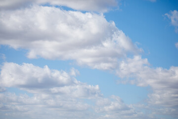 Cloudscape full of white fluffy cummulus clouds