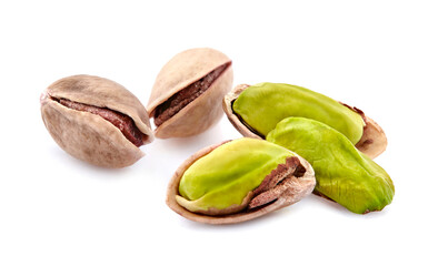 Salted Pistachio nuts in closeup isolated on white background.