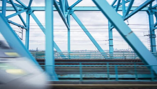 High-speed trains through on the Yangtze River Bridge in China. All logos and trade marks digitally obscured.