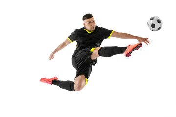 Dynamic portrait of professional male football soccer player training isolated on white studio...