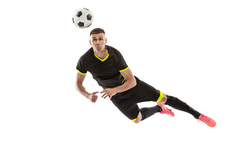 Dynamic portrait of professional male football soccer player training isolated on white studio...