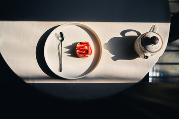 Breakfast with croissants, fresh strawberries, whisked cream and a cup of tea.