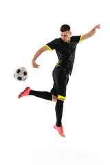 Dynamic portrait of professional male football soccer player training isolated on white studio background. Concept of sport, goals, competition, hobby, achievements