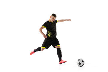 Fototapeta na wymiar Professional male football soccer player in motion and action isolated on white studio background. Concept of sport, goals, competition, hobby, world cup