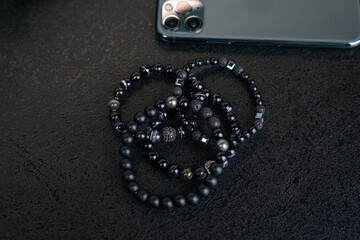 Beautiful black bracelets, different types and models, phone background