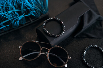 A collection of men's accessories in black in a minimalist style.
