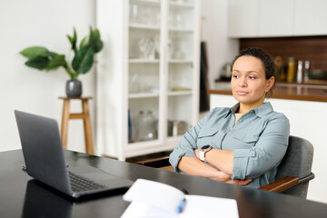 Pensive young woman does not have inspiration for work, feels lack of sleep and fatigue. Bored...