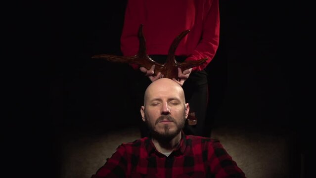 Adultery woman cheated on her man wearing the horns