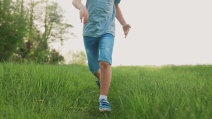 happy family. kid run legs lifestyle close-up in the park at sunset. people in the park concept boy son joyful run. happy family summer. little baby run child fun summer kid dream concept