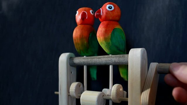 pair of lovebird parrots automaton close-up