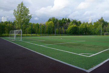 Futsal court in a public outdoor park with artificial turf