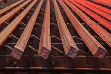 Hot steel billets in continuous casting machine.