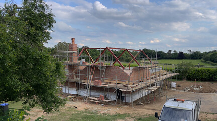 England, UK. 2022. Large house under construction in the English countryside. UK.