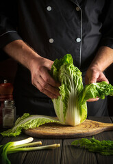 Cooking Napa cabbage salad by the hands of a chef in the kitchen for a diet breakfast.