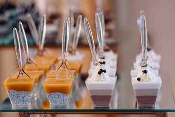 Candy bar with tiramisu cakes, three chocolates and panna cotta