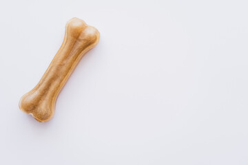 top view of bone shaped pet treat isolated on white.