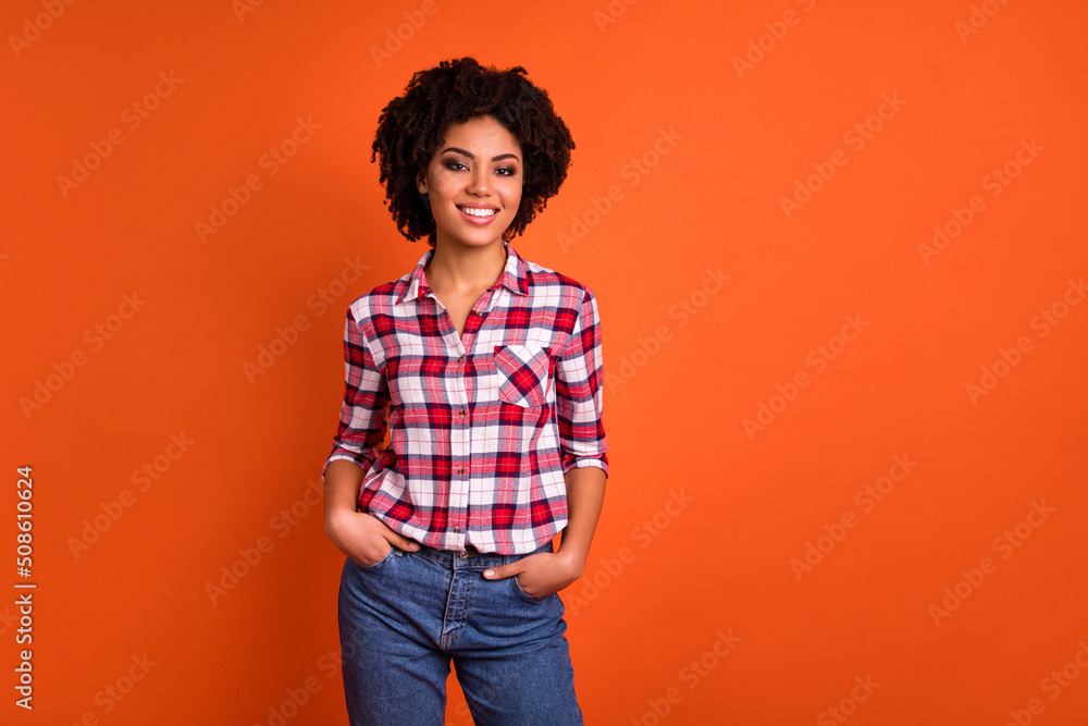 Wall mural photo of nice adorable lady put hands jeans pockets enjoy smiling in camera isolated vibrant color b