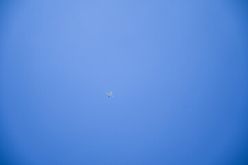 Airplane flying on the blue sky. 