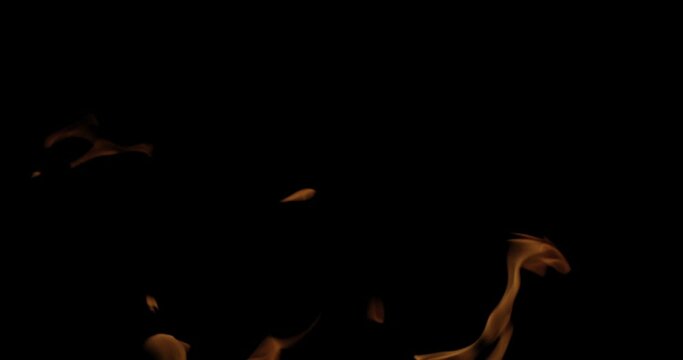 Fire Flames Igniting And Burning, Fiery orange glowing. Abstract background on the theme of fire. Real flames ignite. Royalty high-quality free stock footage of  flames isolated on black background