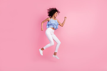 Fototapeta na wymiar Full body profile photo of excited crazy person jumping rejoice isolated on pink color background
