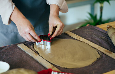 Close Up Photo Of Woman Hands Making Christmas Ornaments Of Clay At Her Workshop