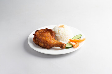 asian deep fried fresh crispy kampong chicken rice with cucumber and tomato in white background halal menu