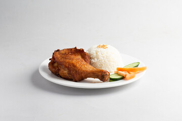 asian deep fried fresh crispy kampong chicken rice with cucumber and tomato in white background halal menu