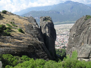 Mountain slot seeing down on city 