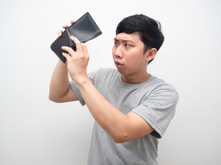 Poor man gesture find money in his wallet serious emotion