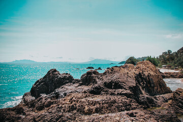 landscape of rocks and sea waves turquoise green sea background. Beautiful water view on a Summer Day.