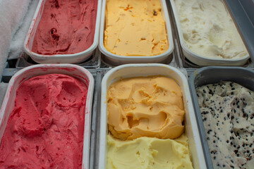Assorted flavor ice cream in display freezer