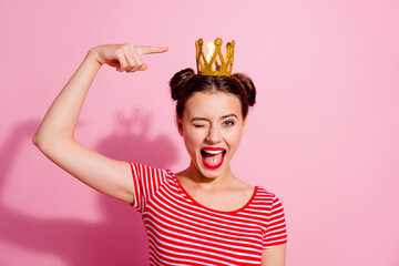 Photo of funky positive person indicate finger golden crown isolated on pink color background