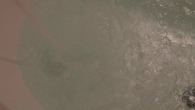 slow motion scene, water flowing in bathtub
