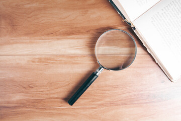 magnifier and book on the table