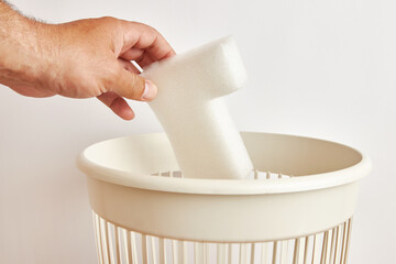 Packaging material is discarded for disposal and recycling.